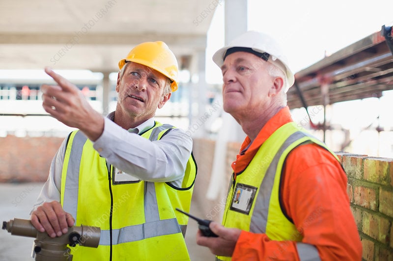 A local roofing contractor discussing flat roof repair options.